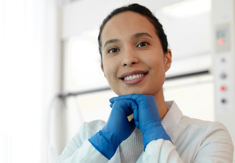 Female scientist smiling.