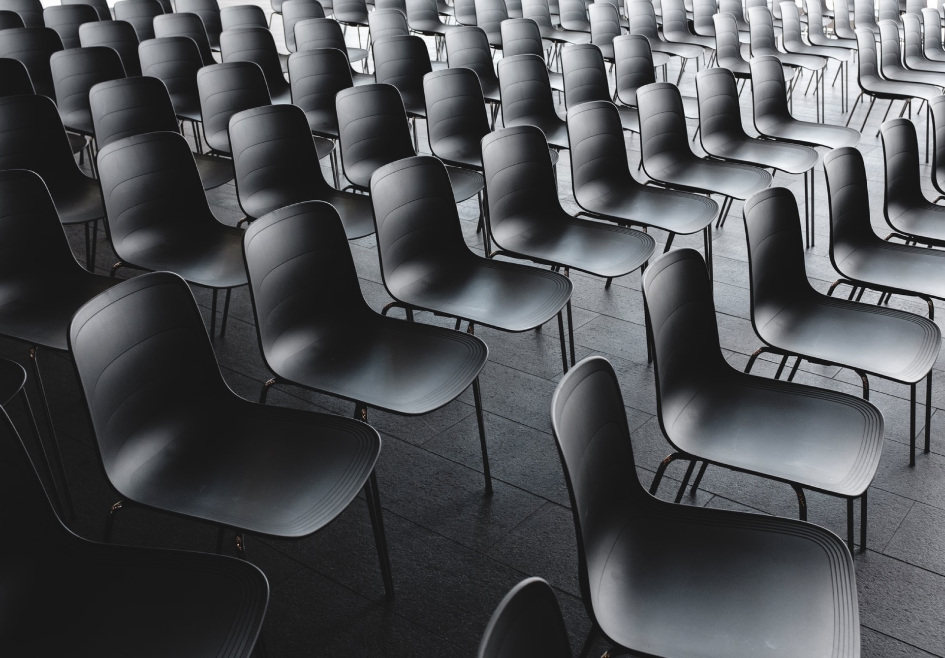 Empty black chairs.