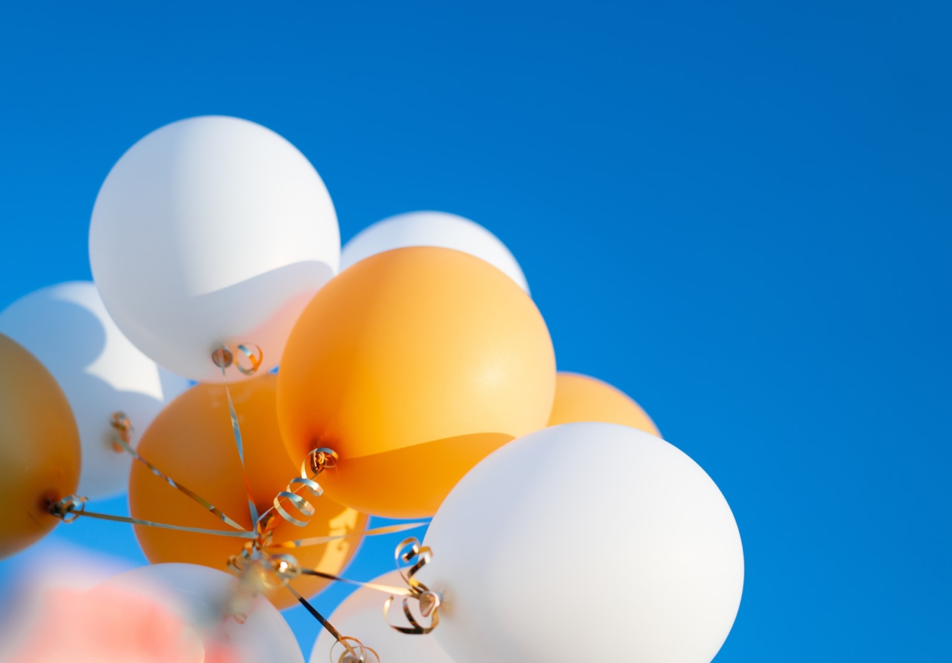 White and orange balloons.