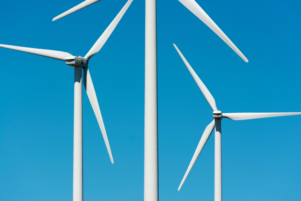 Wind turbines and a blue sky.