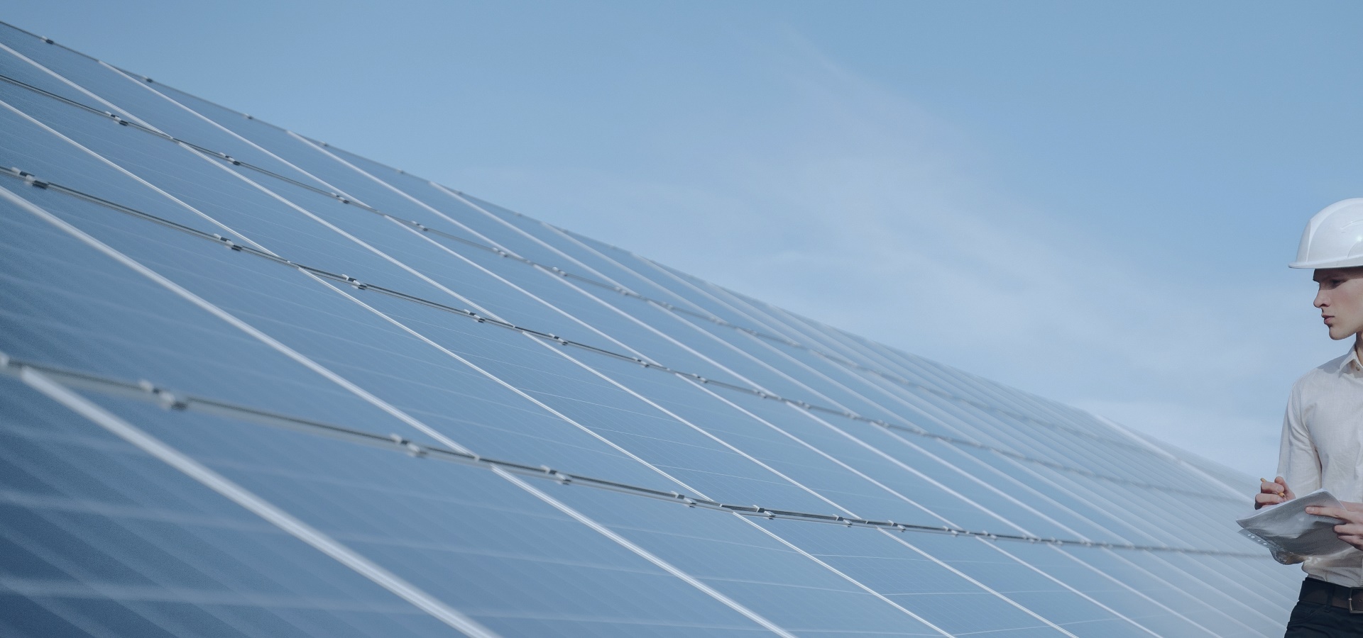 Consultant in front of solar panels.